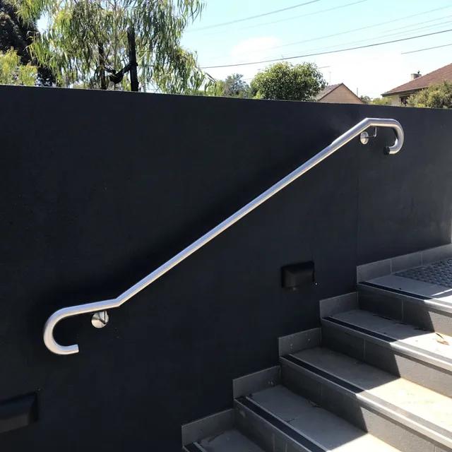 Stainless steel handrail mounted on a wall